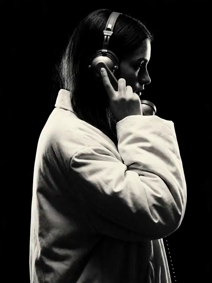 A Moontian listening on headphones