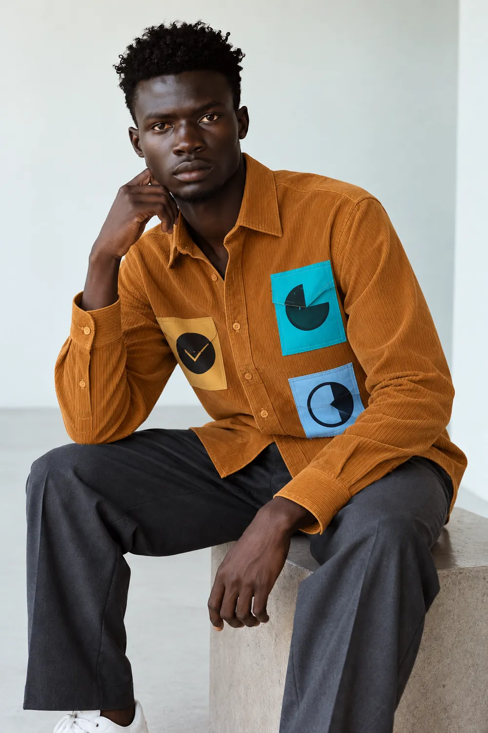 A Moontian seated in the moon-phase patch shirt